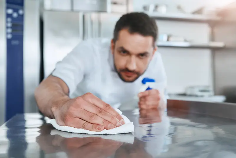 Clean 2 the Kore staff sanitizing commercial kitchen